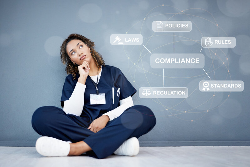 Healthcare professional reviewing regulatory compliance standards including policies, laws, and regulations